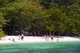 Thailand: Ko Tarutao Marine National Park, a tour group relaxes on the beach at Ko Rawi